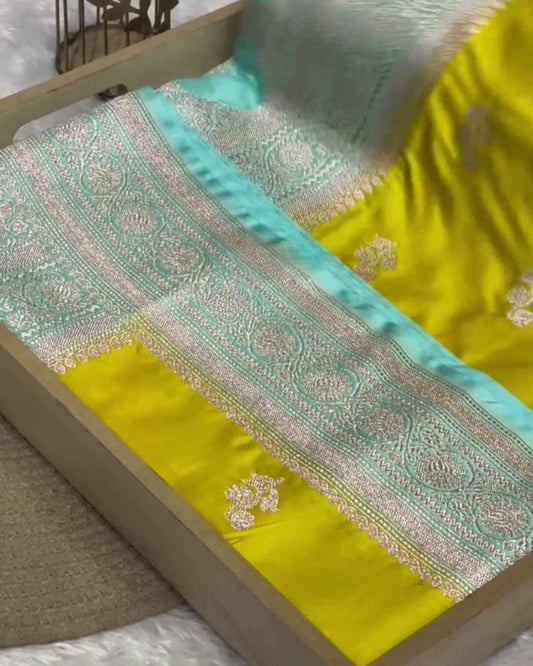 Rajalakshmi – Yellow Banarasi Mashru Satin Silk Saree with Aqua Blue Zari Border