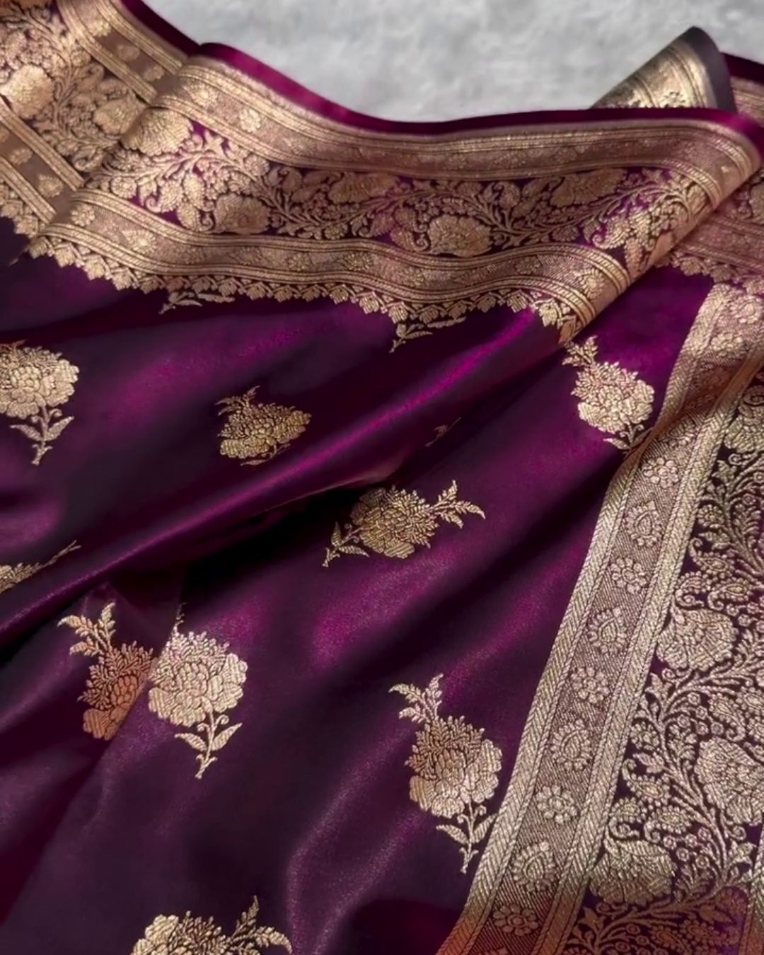 Satyabhama – Plum Satin Saree with Golden Zari Floral Weave