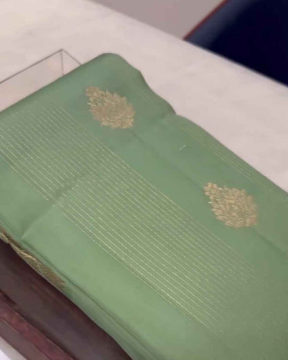 Savitri – Mint Green Kanjivaram Silk Saree with Zari Buta and Golden Border