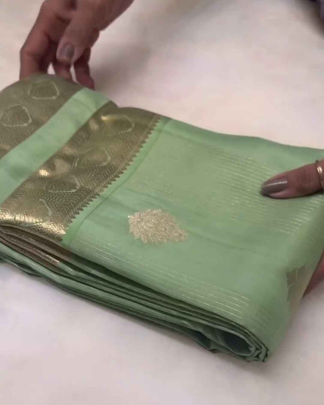 Savitri – Mint Green Kanjivaram Silk Saree with Zari Buta and Golden Border