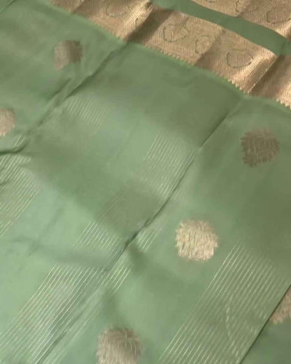 Savitri – Mint Green Kanjivaram Silk Saree with Zari Buta and Golden Border
