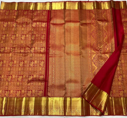 Uma – Vermilion Red Banarasi Soft Silk Saree with Peacock Zari Checks & Grand Floral Pallu