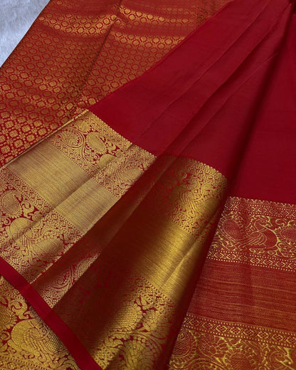 Uma – Vermilion Red Banarasi Soft Silk Saree with Peacock Zari Checks & Grand Floral Pallu